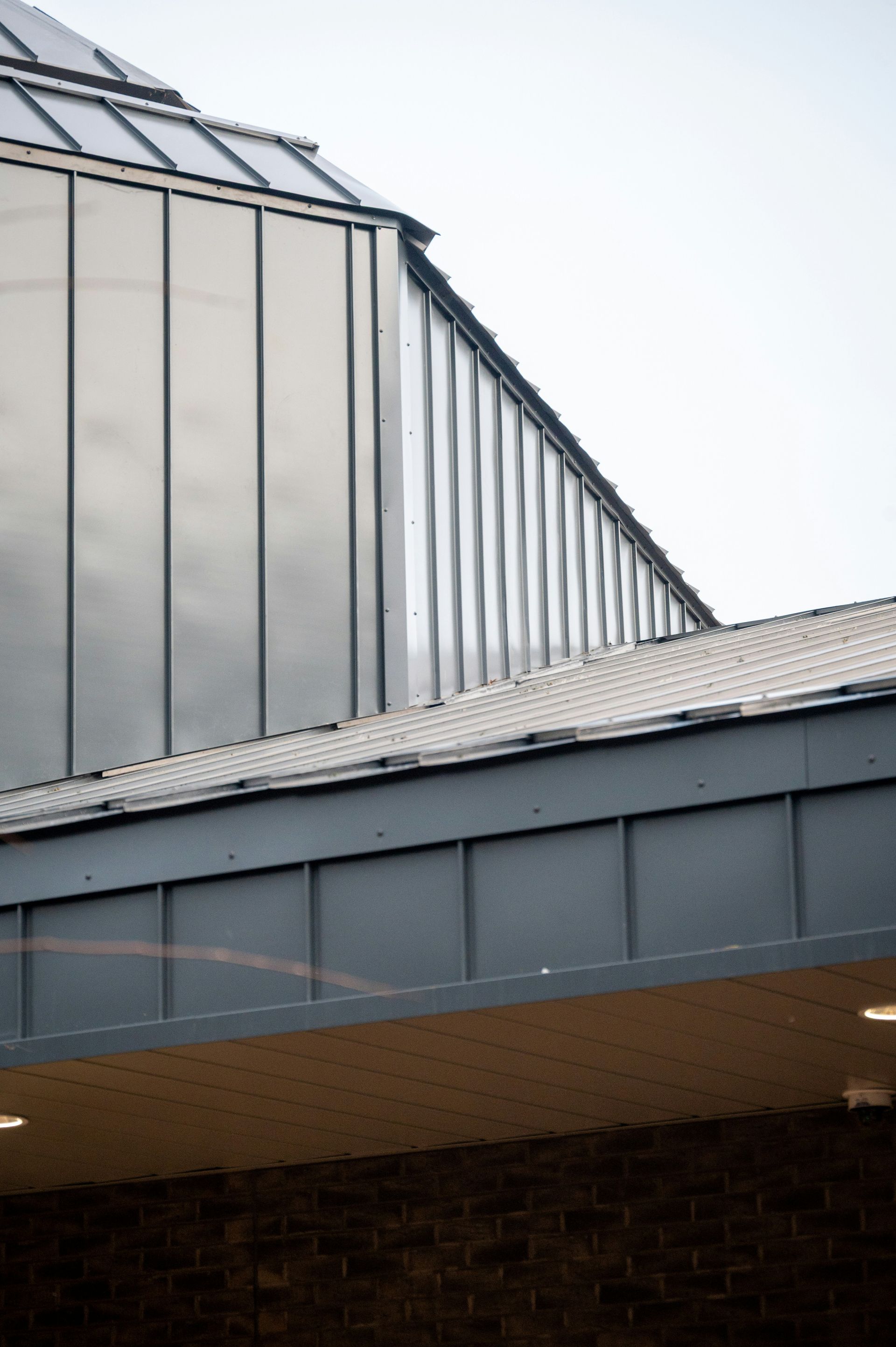 Modern building with metallic facade and glass windows